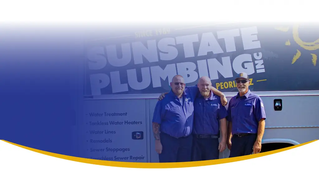 Three Sunstate Plumbing technicians in purple uniform shirts in front of the service van