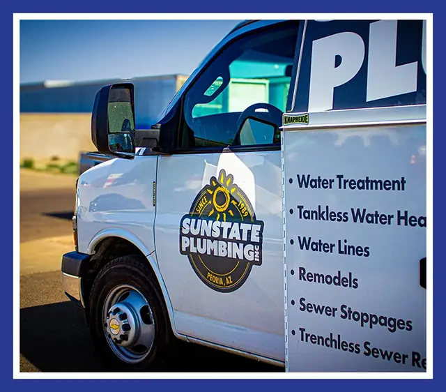Sunstate Plumbing van door with the sun roundel and the list of services
